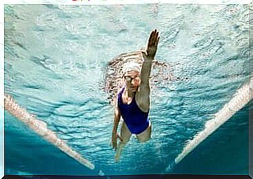 A woman is swimming.