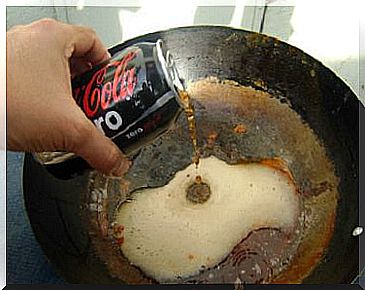 Clean the pans with coca-cola.