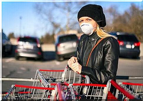 A woman shopping while wearing a mask